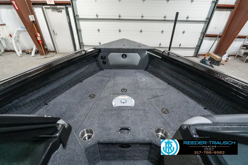 Slide: The Image of Interior view of 2025 Lund 1975 Tyee boat in a garage setting. - 17