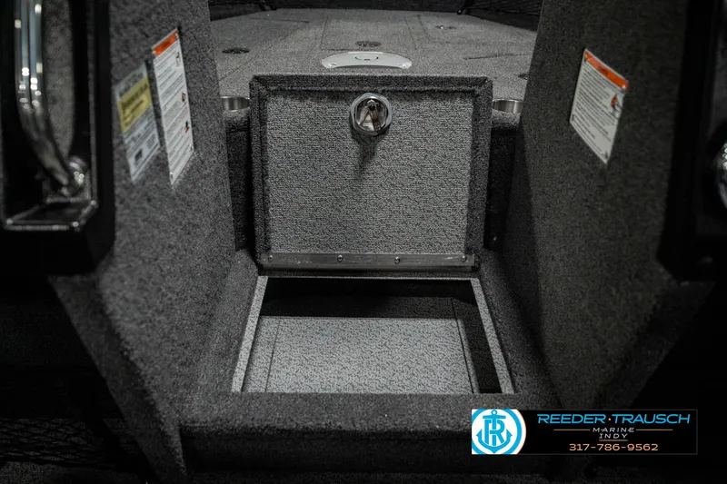 Slide: The Image of Open storage compartment in 2025 Lund 1975 Tyee boat interior. - 28