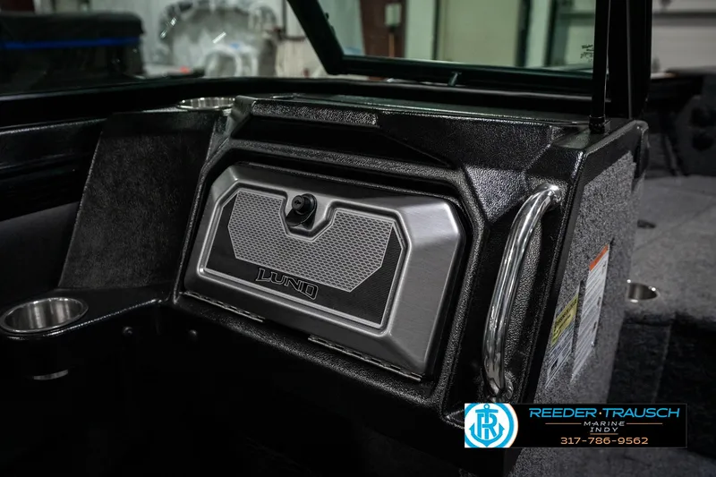 Slide: The Image of Interior of 2025 Lund 1975 Tyee boat, featuring a sleek dashboard design. - 31