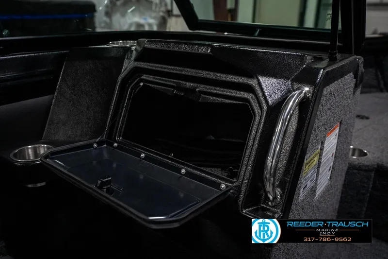 Slide: The Image of Open storage compartment in 2025 Lund 1975 Tyee boat interior. - 32