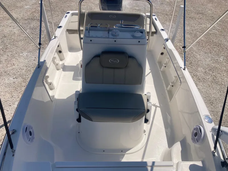 Slide: The Image of 2025 Key West 1720CC boat interior with seating and console, viewed from above. - 10