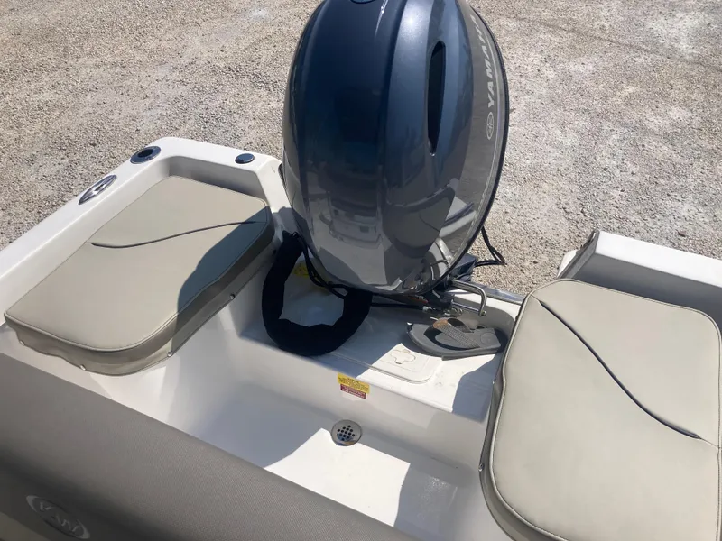Slide: The Image of 2025 Key West 1720CC boat with outboard motor and cushioned seating. - 14