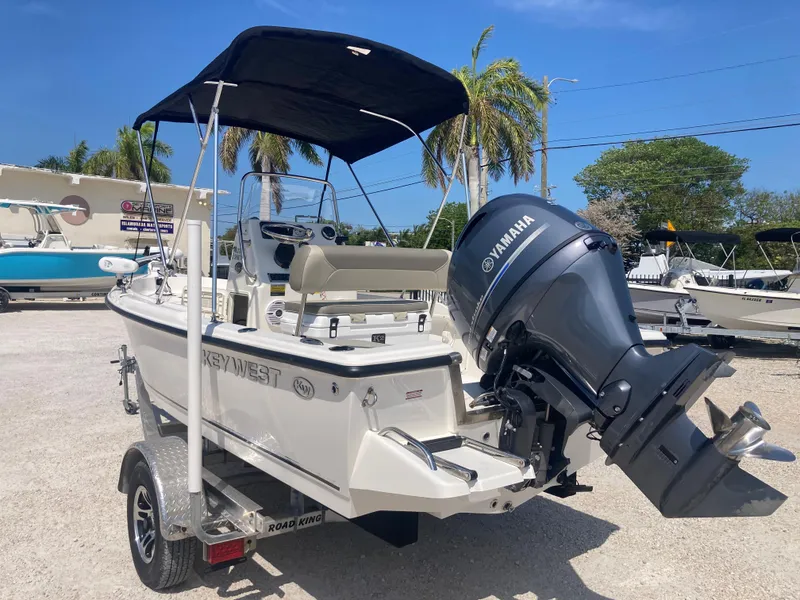 Slide: The Image of 2025 Key West 1720CC boat with Yamaha engine on trailer, parked outdoors. - 4