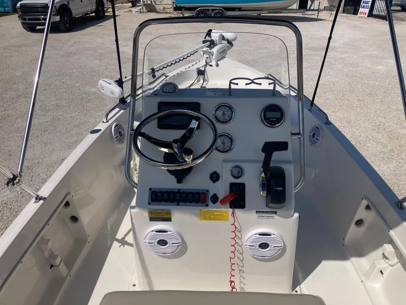 Slide: The Image of 2025 Key West 1720CC boat console with steering wheel and gauges. - 7