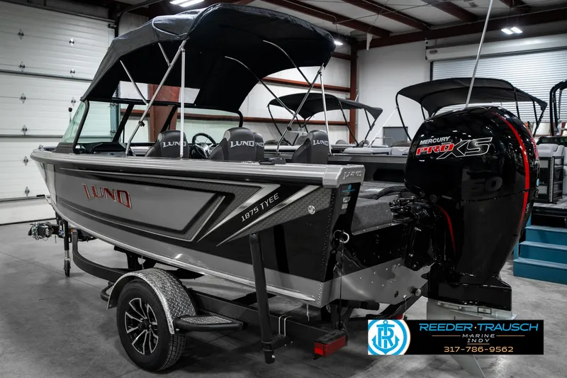 Slide: The Image of 2025 Lund 1875 Tyee boat in showroom, featuring Mercury Pro XS engine. - 10