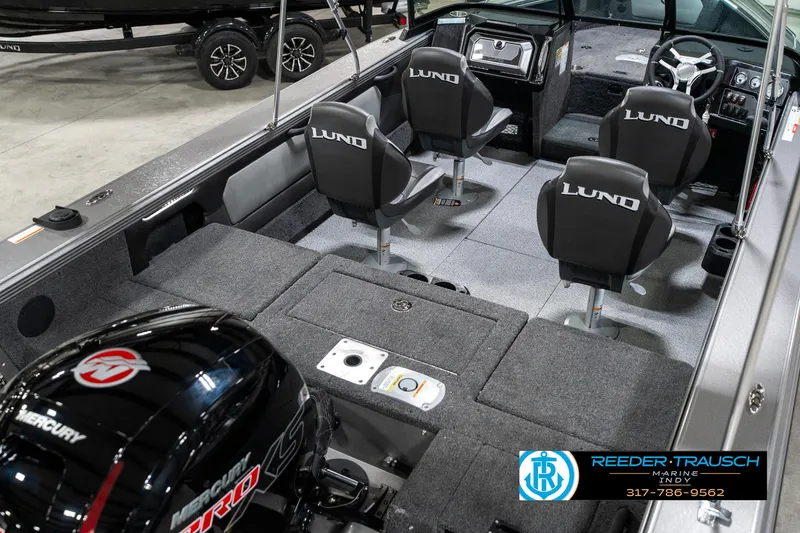 Slide: The Image of 2025 Lund 1875 Tyee boat interior with four seats and Mercury engine. - 14