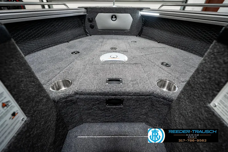 Slide: The Image of 2025 Lund 1875 Tyee boat interior with carpeted deck and cup holders. - 25