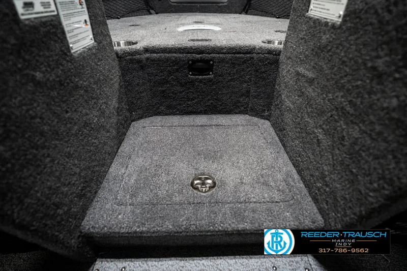 Slide: The Image of 2025 Lund 1875 Tyee boat interior with carpeted storage compartment. - 27