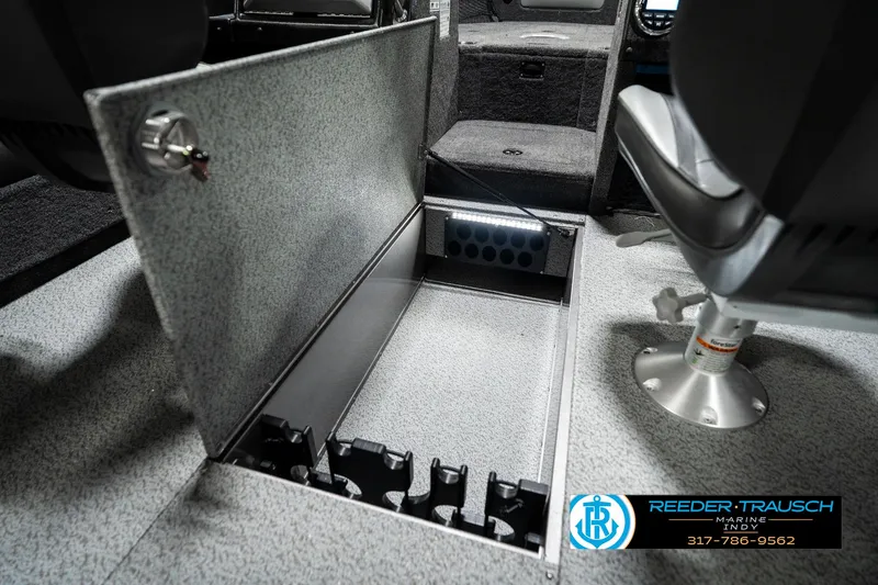 Slide: The Image of 2025 Lund 1875 Tyee boat interior with open storage compartment and seating. - 30