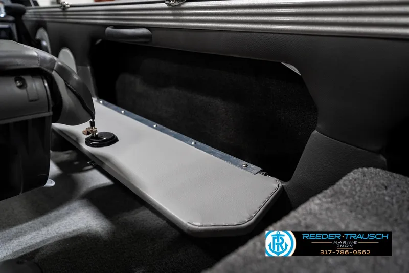 Slide: The Image of 2025 Lund 1875 Tyee interior detail with storage compartment and sleek design. - 32