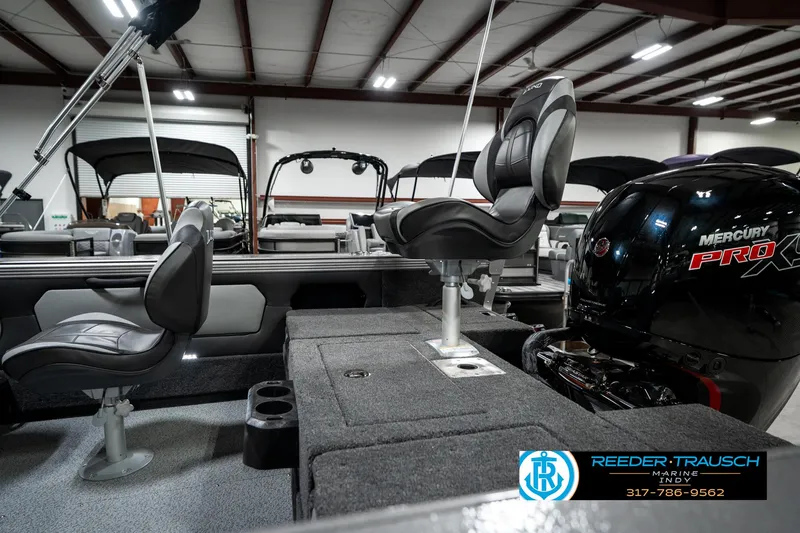 Slide: The Image of 2025 Lund 1875 Tyee boat interior with Mercury Pro XS engine in showroom. - 33