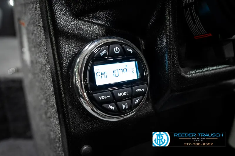 Slide: The Image of 2025 Lund 1875 Tyee boat stereo system with digital display and control buttons. - 40