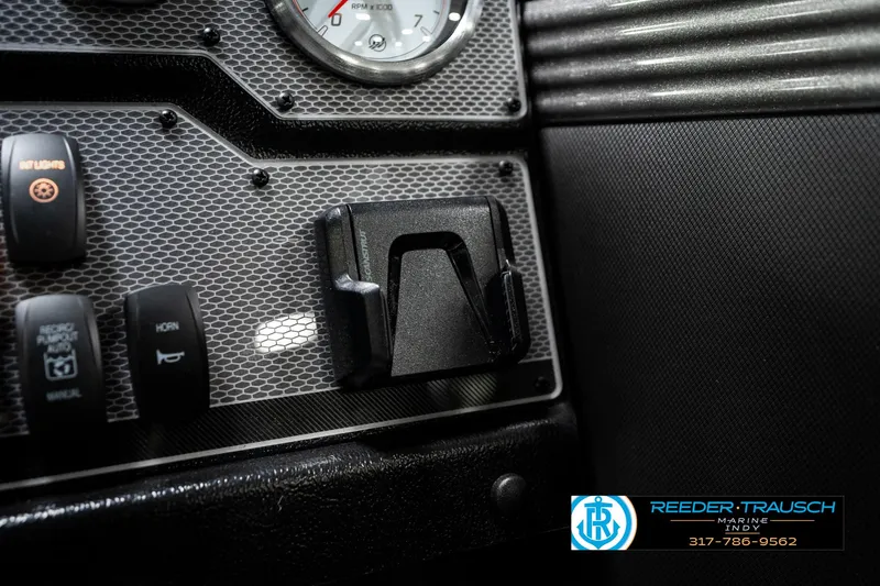 Slide: The Image of Dashboard of 2025 Lund 1875 Tyee boat with control switches and gauge. - 43