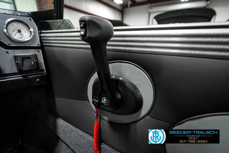 Slide: The Image of 2025 Lund 1875 Tyee boat interior with control lever and gauge. - 44