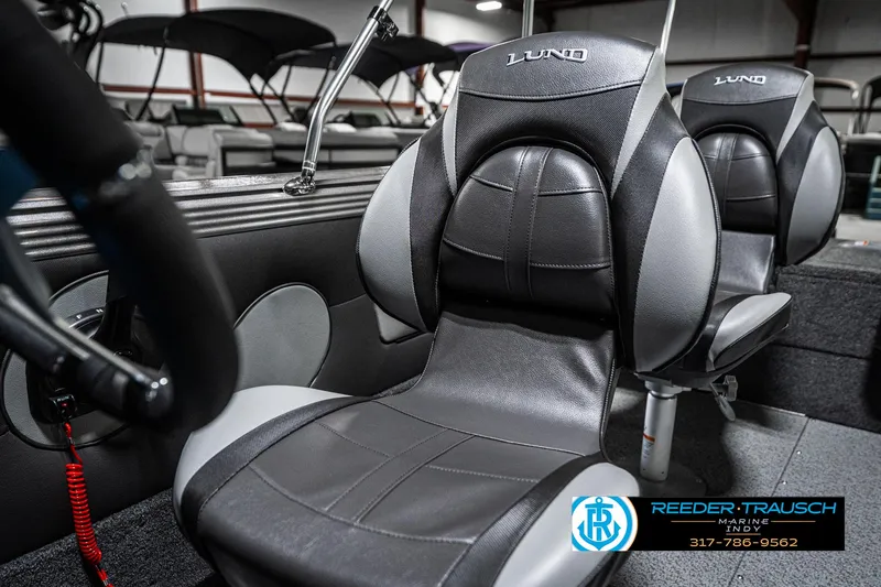 Slide: The Image of Interior of 2025 Lund 1875 Tyee boat with sleek black and gray seating. - 45