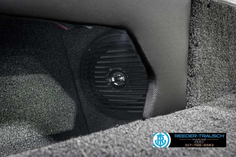 Slide: The Image of 2025 Lund 1875 Tyee interior speaker detail with textured carpet finish. - 47