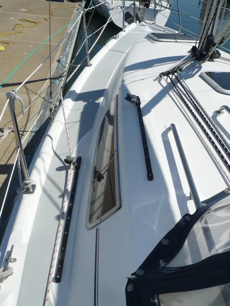 Slide: The Image of 2008 Hunter 31 sailboat deck with rigging and window details. - 15