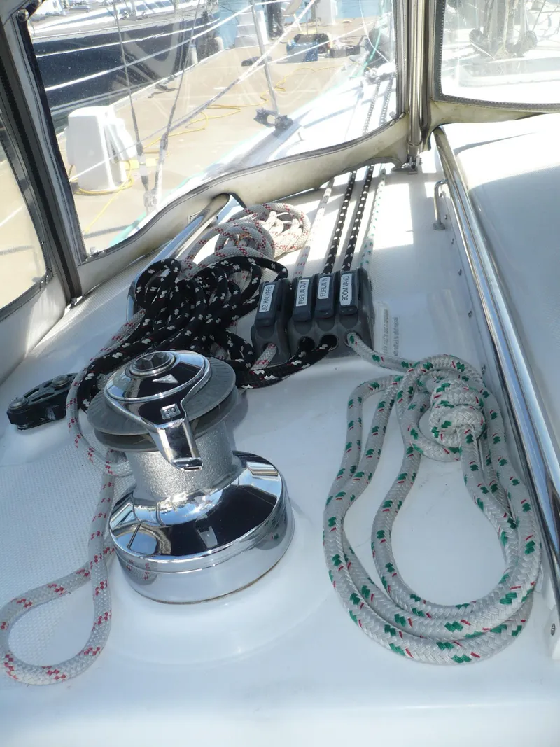 Slide: The Image of 2008 Hunter 31 sailboat deck with winch and ropes. - 16