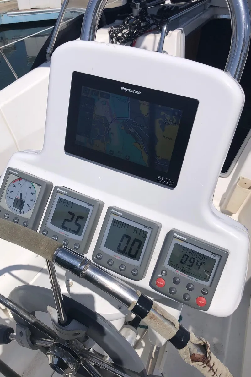 Slide: The Image of Control panel of a 2008 Hunter 31 sailboat with navigation instruments and display. - 17