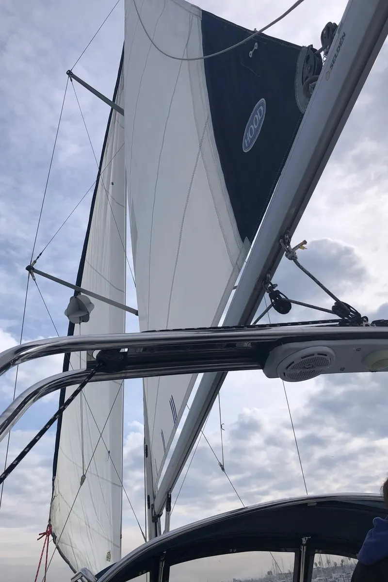 Slide: The Image of Sailing yacht Hunter 31, 2008 model, with sails unfurled against a cloudy sky. - 19