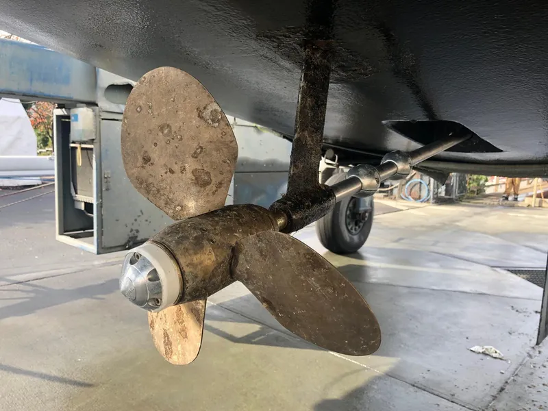 Slide: The Image of Propeller of 2008 Hunter 31 sailboat, close-up view, showing wear and marine growth. - 21