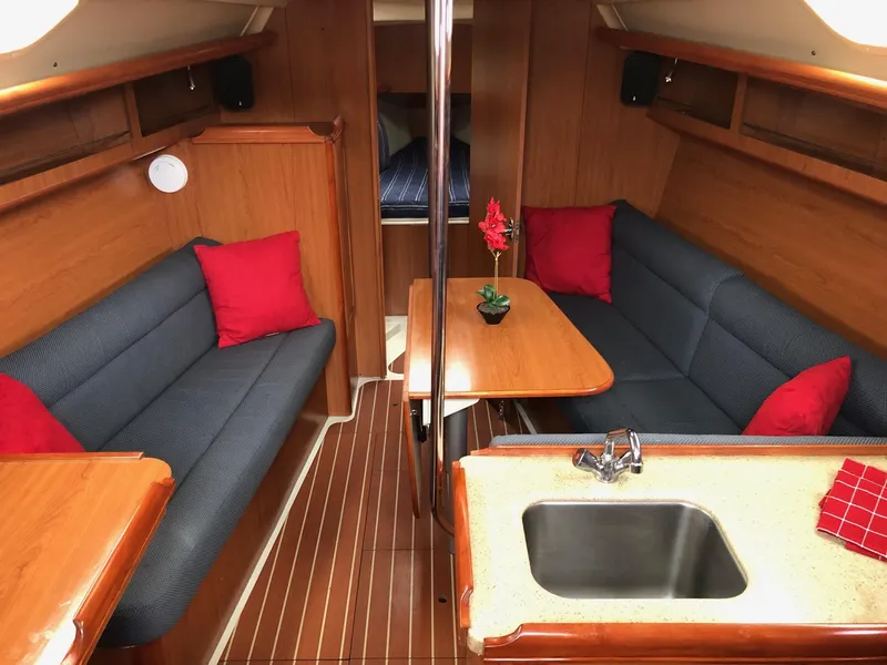 Slide: The Image of Interior of 2008 Hunter 31 sailboat with cozy seating and wooden finishes. - 3