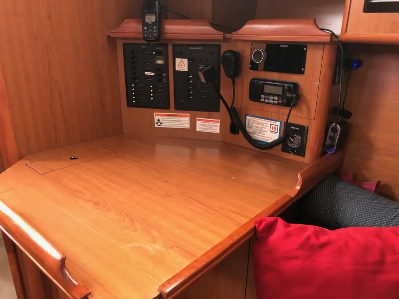 Slide: The Image of Navigation station in 2008 Hunter 31 sailboat with communication equipment and control panel. - 7