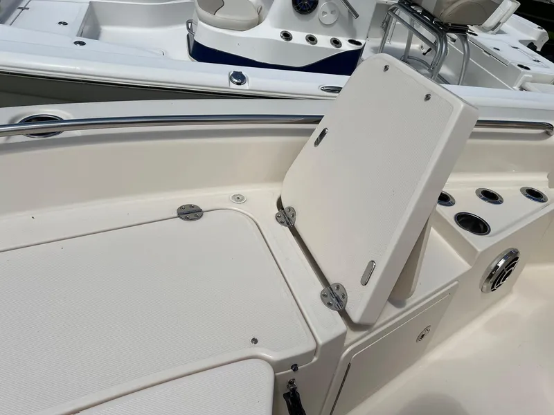 Slide: The Image of 2014 Grady-White 251 Coastal Explorer boat interior with storage compartments and seating. - 10