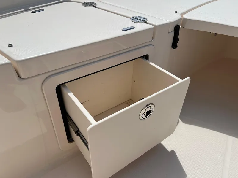 Slide: The Image of Open storage compartment on 2014 Grady-White 251 Coastal Explorer boat. - 15