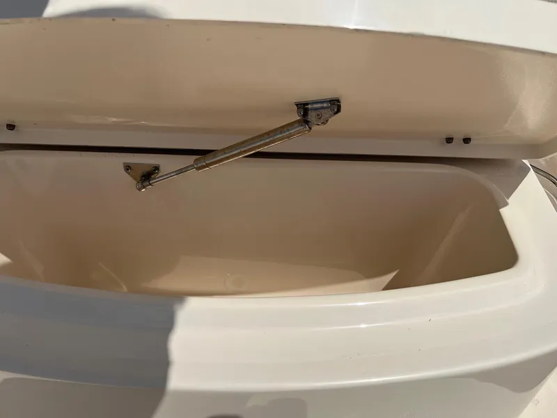 Slide: The Image of Open storage compartment on 2014 Grady-White 251 Coastal Explorer boat. - 17