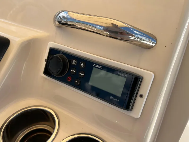 Slide: The Image of Control panel on 2014 Grady-White 251 Coastal Explorer boat with Fusion audio system. - 22