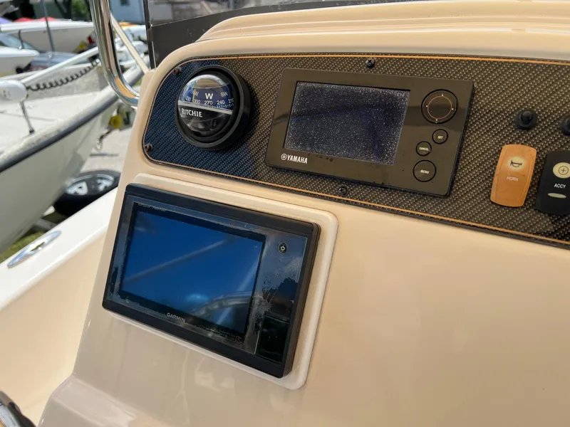 Slide: The Image of Dashboard of 2014 Grady-White 251 Coastal Explorer with navigation instruments. - 24