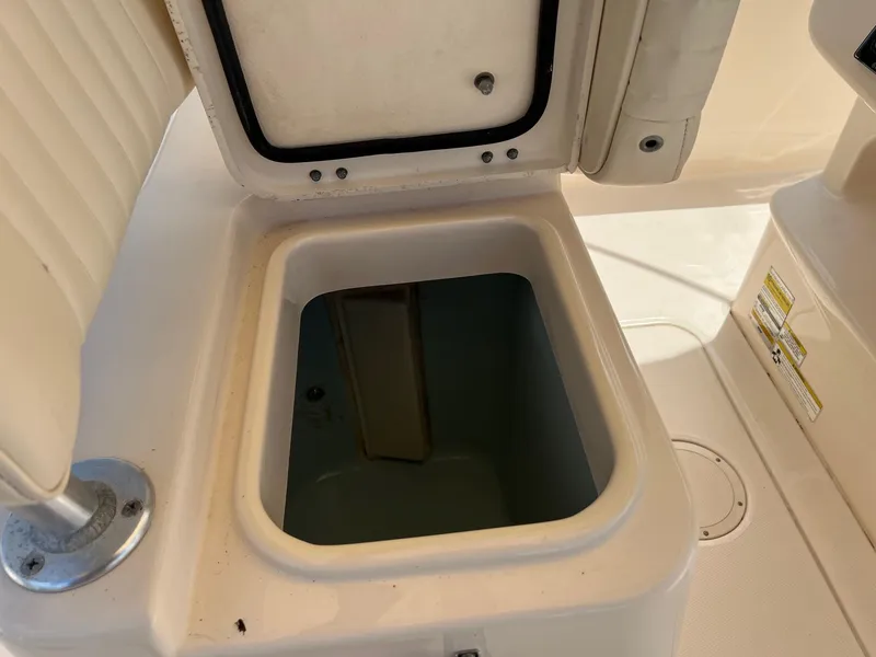 Slide: The Image of Open storage compartment on 2014 Grady-White 251 Coastal Explorer boat. - 25