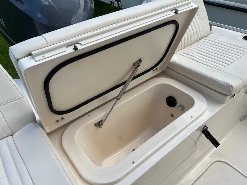 Slide: The Image of Open storage compartment on 2014 Grady-White 251 Coastal Explorer boat. - 34