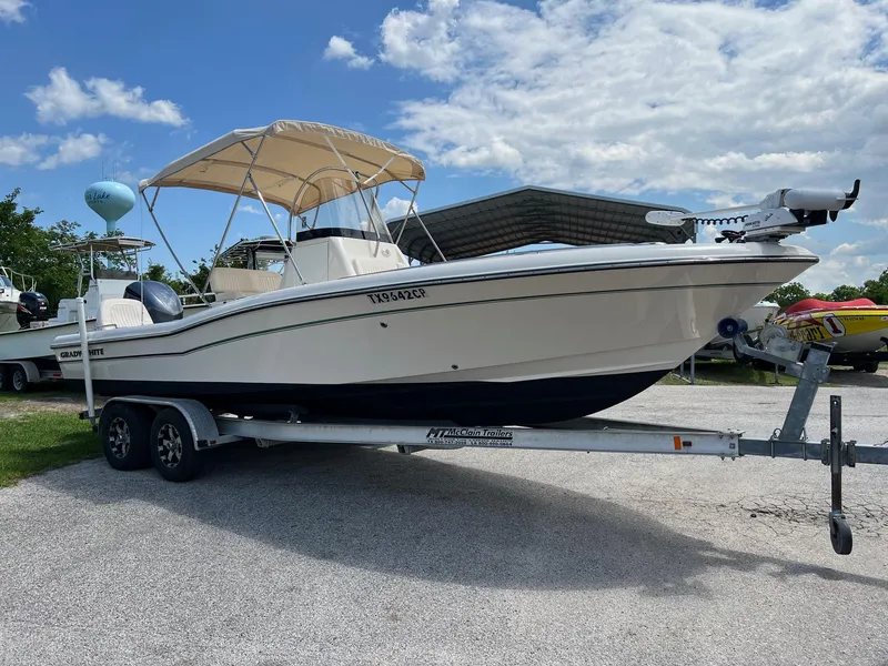 Slide: The Image of 2014 Grady-White 251 Coastal Explorer boat on trailer under blue sky. - 38