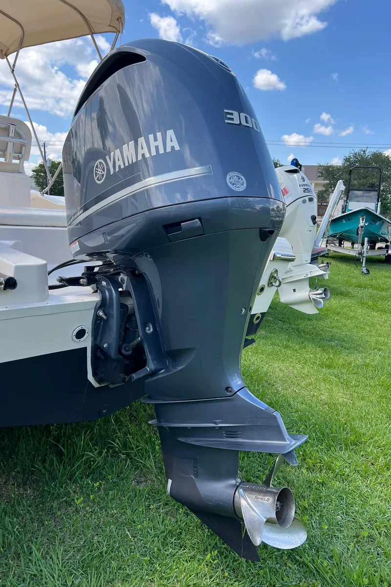Slide: The Image of 2014 Grady-White 251 Coastal Explorer with Yamaha 300 outboard engine on grassy area. - 41