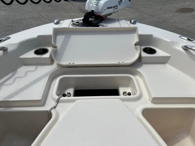 Slide: The Image of 2014 Grady-White 251 Coastal Explorer boat deck with storage compartments and Minn Kota trolling motor. - 7