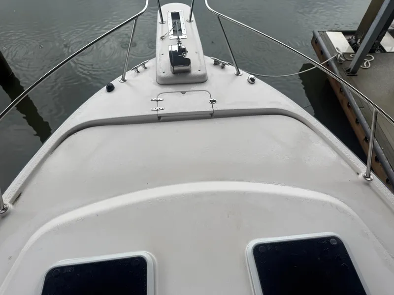 Slide: The Image of Bow view of 2002 Grady-White Express 330 boat docked at marina. - 12