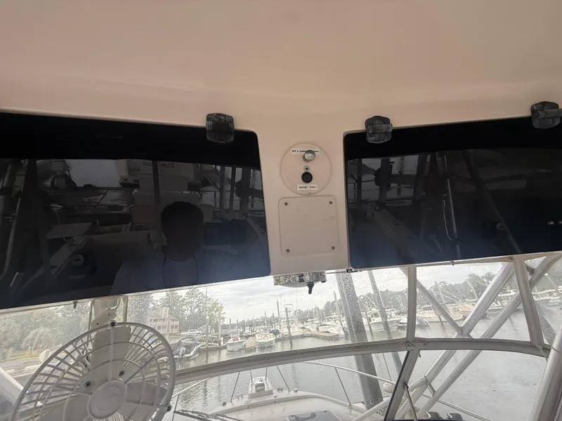 Slide: The Image of 2002 Grady-White Express 330 boat interior with marina view through windshield. - 21