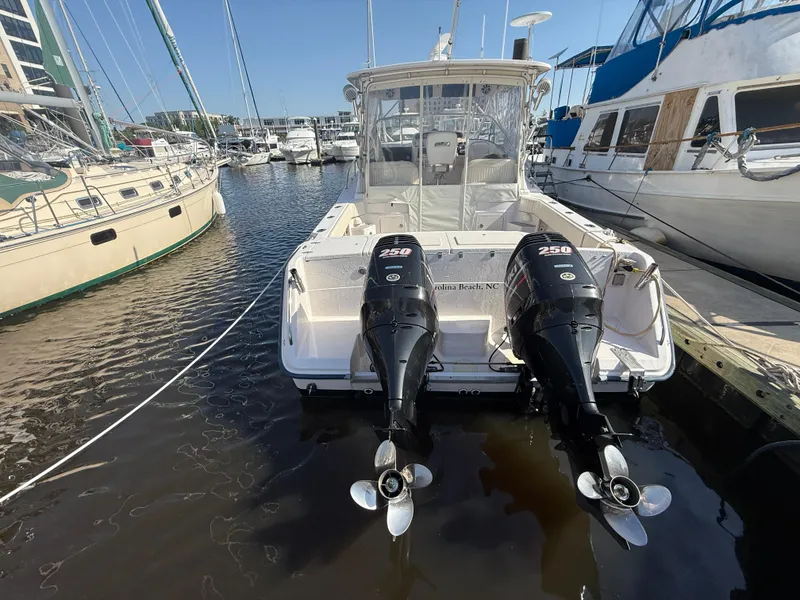 Slide: The Image of 2002 Grady-White Express 330 boat docked with twin 250 horsepower engines. - 31