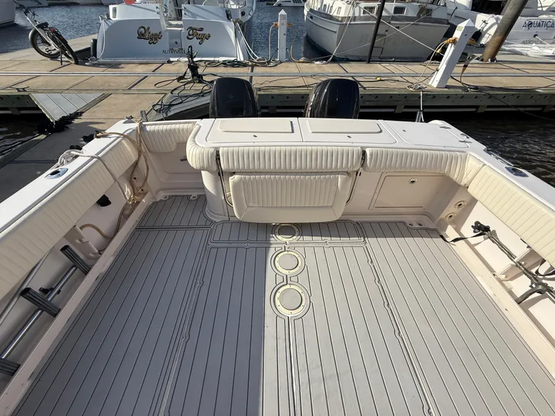 Slide: The Image of 2002 Grady-White Express 330 boat deck with seating, docked at marina. - 40