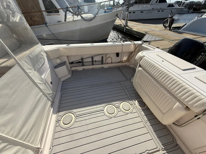 Slide: The Image of 2002 Grady-White Express 330 boat deck with seating, docked at marina. - 41
