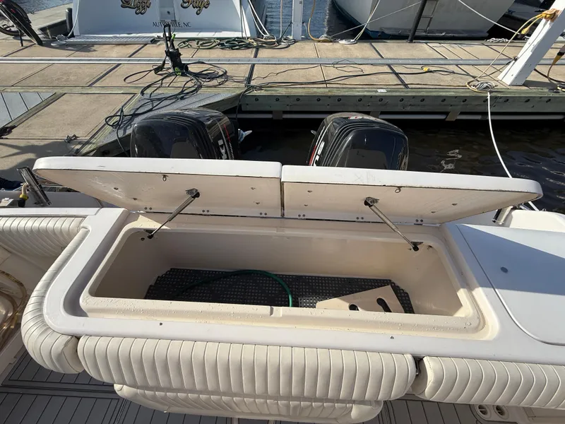 Slide: The Image of Open storage compartment on 2002 Grady-White Express 330 boat at dock. - 44