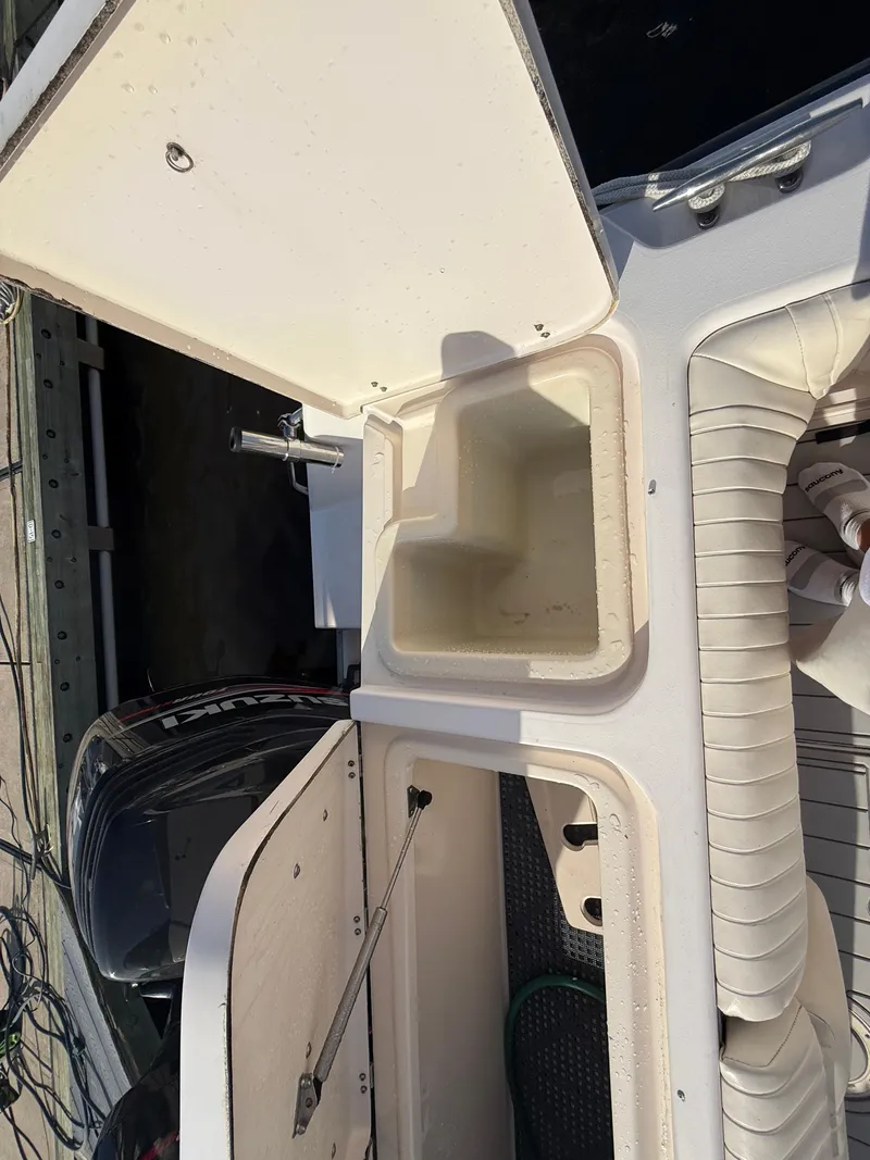 Slide: The Image of 2002 Grady-White Express 330 boat interior with open storage compartments. - 45