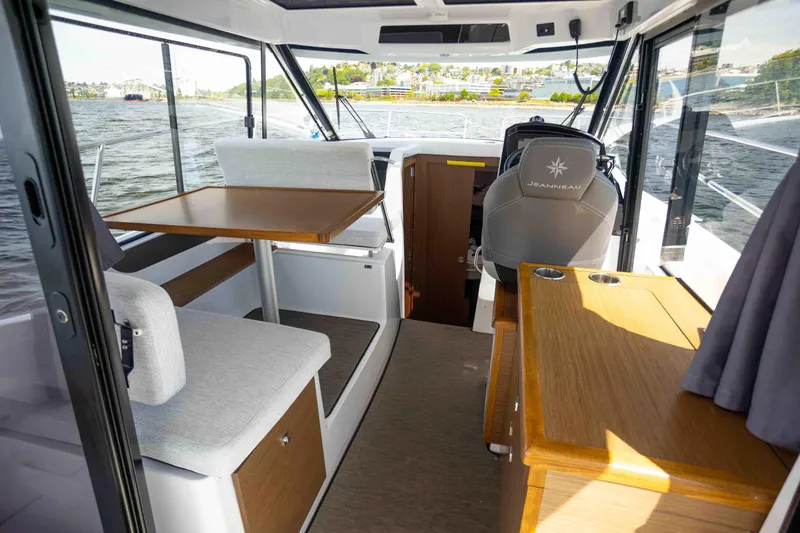 Slide: The Image of Interior of 2022 Jeanneau NC Weekender 895 boat with seating and helm. - 9