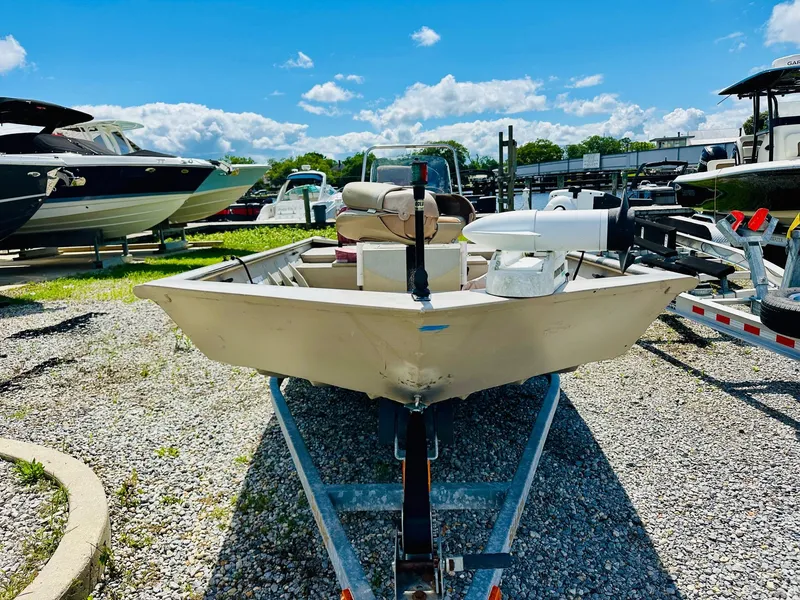 Slide: The Image of 2008 SeaArk x160 boat on trailer under clear blue sky. - 6
