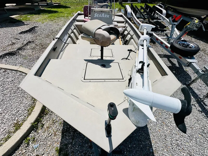 Slide: The Image of 2008 SeaArk x160 boat with trolling motor on gravel surface. - 7