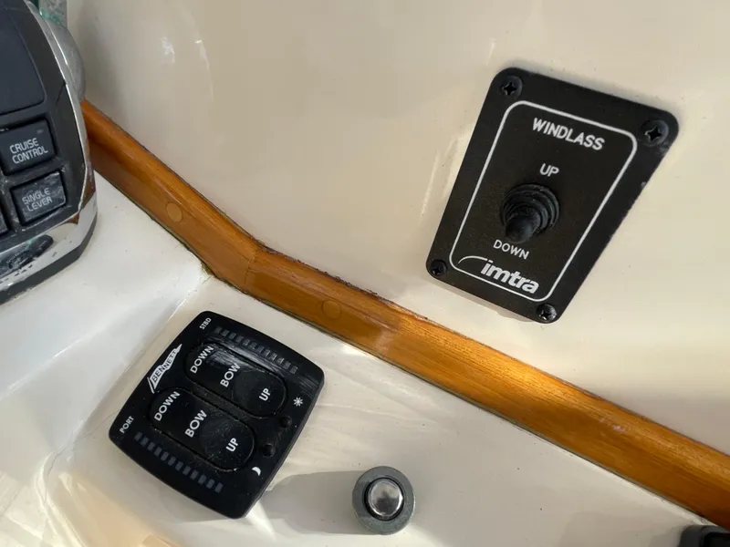Slide: The Image of Control panel of a 2015 Fortier 30 boat with windlass and trim tab switches. - 17