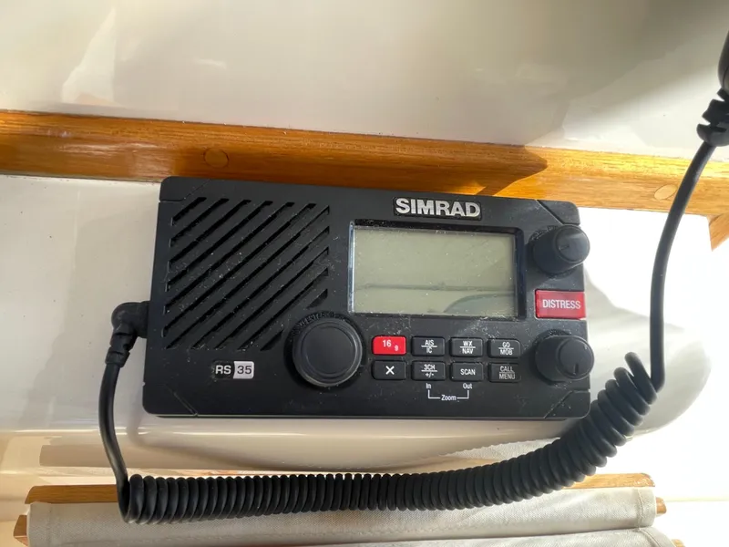 Slide: The Image of Simrad RS35 marine radio on a 2015 Fortier 30 boat dashboard. - 18