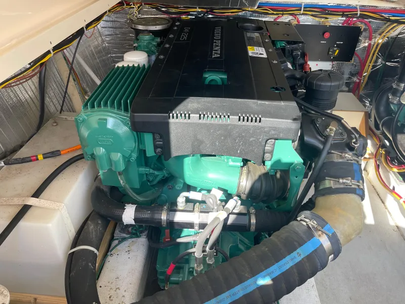 Slide: The Image of Engine compartment of a 2015 Fortier 30 boat, featuring a Volvo Penta engine. - 27